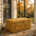 One additional straw bale styled on a front porch